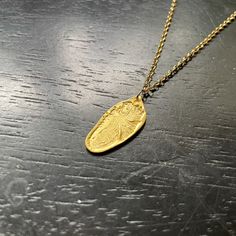 This design features my carved Reversible Feather in Gold! These pendants are made with GOLD VERMEIL! GOLD VERMEIL is a premier version of a thick electro-plating of 23.5 karat Gold over a solid Sterling Silver base- it's the right solution for us to provide everyone who wants their 永 pieces in GOLD that are durable, beautiful, and affordable! Still, we recommend that you wear these pieces gently and thoughtfully. The Vermeil is a surface finish after all, and although these pieces are quite sta Etched Yellow Gold Brass Jewelry, Gold Oval Brass Necklaces, Artisan Gold Teardrop Pendant Jewelry, Gold Coin Pendant Jewelry From Recycled Gold, Gold Coin Pendant Jewelry In Recycled Gold, Hammered Yellow Gold Medallion Necklace, Gold Oval Brass Necklace, Oval Gold Brass Necklace, 22k Gold Engraved Medallion Jewelry