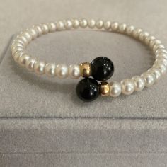 Culture Pearl 2 Gold Beads With 2 Large Black Onyx Beads. Beautiful & Very Comfortable Elegant Black Beaded Bracelets, Elegant Black Beaded Bracelets With 8mm Beads, Elegant Onyx Beaded Bracelets With Black Beads, Elegant Black Pearl Bracelet With Round Beads, Black Round Pearl Bracelet Gift, Black Round Pearl Bracelet As Gift, Black Pearl Bracelet Gift, Classic Black Beaded Bracelets For Formal Occasions, Elegant Onyx Beaded Bracelets With Polished Beads