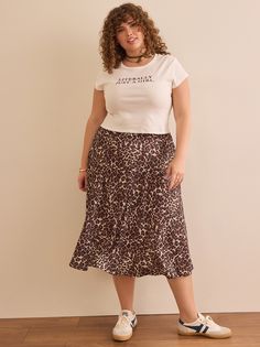 Bella Leopard Midi Skirt in Brown Casual Leopard Print Skirt For Spring, Casual Leopard Print Midi Skirt Bottoms, Casual Leopard Print Skirt For Day Out, Flowy Leopard Print Skirt For Spring, Casual Leopard Print Midi Skirt, Lepord Print Midi Skirt, Spring Leopard Print Midi Skirt, Fall Leopard Print Midi Skirt, Casual Flowy Leopard Print Skirt