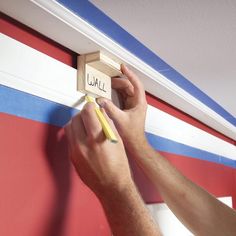 a person holding a pencil and eraser on a wall with the word jail written on it