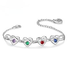 The Engraved Name Birthstone Heart Bracelet is a captivating and personalized piece of jewelry that combines elegance with a heartfelt touch. Crafted from high quality materials, this bracelet features a lustrous finish that makes it a versatile accessory suitable for both everyday wear and special occasions. The centerpiece of this bracelet is beautifully shaped hearts, polished to a mirror finish and designed to catch the eye. These hearts serve as a canvas for personalization; they each hold a vibrant birthstone. These gems represent the birth month of the wearer or someone dear to them, adding a colorful and personal significance to the bracelet. Engraving a name or a meaningful word next to each heart, makes the piece truly unique to the wearer.  The bracelet is designed with an adjus Names Bracelet, Bracelet For Mom, Grandma Bracelet, Silver Bracelets For Women, Moms Bracelet, Personalized Mother's Day Gifts, Birthstone Bracelet, Christmas Bracelet, Engraved Bracelet