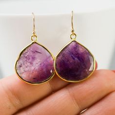 "Beautiful bezel set Natural Purple Amethyst drop Earrings. ✦Gemstone: Purple Amethyst (*this stone has natural internal cracks and inclusions) ✦Stone Size: ~ 20mm x 20mm (0.75\" x 0.75\") ✦Earring Length: ~35mm (1.5\") ✦Bezel Metal: 18K Gold Vermeil (18K Gold plated 925 Sterling Silver) ✦Hook Metal: 14K Gold Filled ✦Because we use natural stones, the stones may vary slightly in shape, size and color. **ALSO AVAILABLE IN STERLING SILVER** Please view my full collection of ✦ EARRINGS ✦: http://ww Teardrop Crystal Earrings Gift, Teardrop Crystal Earrings For Pierced Ears Gift, Amethyst Earrings For Gift, Purple Earrings With Ear Wire For Anniversary, Purple Hook Earrings For Anniversary, Purple Anniversary Earrings With Ear Wire, Purple Crystal Earrings With Ear Wire As Gift, Purple Crystal Earrings Matching Set For Gift, Purple Crystal Earrings For Gift