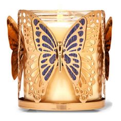 a candle that is shaped like a butterfly with blue wings on the front and sides