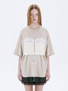 This is a trendy and casual top by MARGESHERWOOD that is made out of high quality and sturdy material. With distinctive mood of the design and comfortable wear, you can style it for your casual daily outfit.- Relaxed oversized silhouette- Corset detail with eyelets and strings- Cotton 100% pigment fabric Neutral Relaxed Fit Tops For Spring, Spring Neutral Relaxed Fit Tops, Beige Short Sleeve Tops For Fall, Neutral Tops For Spring Loungewear, Neutral Spring Loungewear Tops, Oversized Short Sleeve Tops For Layering, Chic Beige Blouse With Crew Neck, Chic Oversized Tops For Loungewear, Oversized Short Sleeve Knit Top For Fall