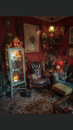 a living room filled with furniture and pictures on the wall