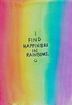 the words i find happiness in rainbows are written on a piece of colored paper