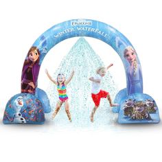 two children jumping in the air on an inflatable arch with frozen world characters