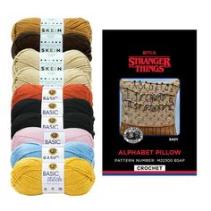 six skeins of different colors of yarn with the label for each item in front