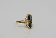 14K Yellow Gold Retro Onyx Filigree Ring, Diamond Center, .75 inch across, white & black stone, Ring size 7, 3.3 grams. Stock # BB101R15 Most rings are sizable for a small fee. If the ring you are considering is the incorrect size contact us for a quote. This listing contains photographs of the actual item you will receive. Our items are in excellent condition with little or no signs of wear and many are one of a kind pre-owned estate finds. Please look closely at the pictures in this listin Black Elegant Engraved Ring For Formal Occasions, Elegant Black Engraved Ring For Formal Occasions, Elegant Black Engraved Ring For Anniversary, Elegant Engraved Ring With Black Enamel For Anniversary, Heirloom Black Enamel Rings For Wedding, Elegant Black Engraved Ring With Polished Finish, Elegant Black Enamel Engraved Ring For Formal Occasions, Elegant Formal Engraved Ring With Black Enamel, Black Engraved Gemstone Ring For Anniversary