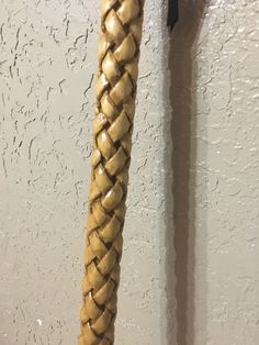 a close up of a rope hanging on a wall