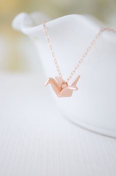 Rose gold origami crane necklace - rose gold crane - so cute and creative Crane Necklace, Origami Crane, Diy Schmuck, Small Jewelry, Diamond Are A Girls Best Friend, Rose Gold Necklace, Schmuck Design, Pretty Jewellery, Bling Bling