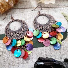 These boho chandelier earrings add a burst of colorful boho style to any outfit! Your choice of Copper or brass filigree crescents that hold a stunning chandelier of colorful shells that whimsically move with you. Simply stunning pair of boho shell earrings that will have you feeling gorgeous inside and out! - Antiqued copper filigree - Real shells - Copper Or Brass filigree earring settings - Dramatic 3 inch long length - Boho Beach bride wedding jewelry PERFECTION! 2016©Wanderlust Hearts desig Bohemian Dangle Earrings For Beach, Nickel-free Bohemian Earrings For Beach, Bohemian Nickel-free Earrings For Beach, Bohemian Shell Earrings For Gift, Bohemian Shell-shaped Earrings For Gift, Bohemian Shell Dangle Earrings, Bohemian Dangle Shell Earrings, Bohemian Dangle Earrings, Colorful Bohemian Jewelry For Summer