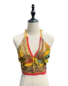 This vibrant, hand-embroidered bikini halter top offers stylish Boho-inspired fashion with its colorful threads and sequin embellishments. Paired with jeans or a skirt, this is the perfect summer top to stand out in and make a statement. The lining is a contrasting color to give it a unique, eye-catching look. One Size Made in India Care Instructions: Dry clean only Girl In The Mirror, Colorful Threads, Inspired Fashion, The Mirror, Summer Top, Bright Orange, Perfect Summer, Bright Pink, Halter Top