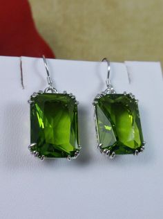 Peridot Earrings, Rectangle gem with sterling silver filigree, Art nouveau Jewelry Emerald Cut Green Sterling Silver Earrings, Elegant Rectangular Emerald Earrings For May Birthstone, Elegant Rectangular May Birthstone Earrings, Formal Rectangular Earrings With May Birthstone, Rectangular Gemstone Earrings For May Birthstone, Classic Green Drop Earrings, Sterling Silver Rectangular Jewelry For May Birthstone, Lime Green Earrings For Gift, Nickel-free Peridot Elegant Jewelry