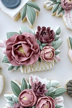 decorated cookies with flowers and leaves on them