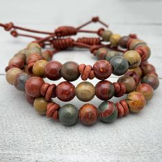 Red Cherry Creek Jasper Gemstone and Leather Bracelet - Etsy Adjustable Brown Jasper Bracelet, Rustic Brown Bracelets With Natural Stones, Brown Rustic Beaded Bracelets With Round Beads, Artisan Brown Bracelets For Everyday Wear, Artisan Brown Bracelets For Everyday, Brown Artisan Everyday Bracelets, Nature-inspired Brown Beaded Bracelets With Natural Stones, Earthy Brown Bracelets For Everyday Wear, Earthy Brown Bracelets For Everyday