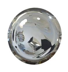 a clear glass bowl with black and white fish on it