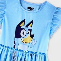 Your kiddo will love lounging on their bed in this Bluey Dress-Up Nightgown. Designed in a blue hue, this nightgown features a graphic of Bluey on the bodice with an allover print on the skirt for a fan-favorite look. Made from lightweight fabric, this nightgown offers them all-night comfort, while the cap sleeves with ruffles and sheer mesh overlay lend it an extra sweet flair. Blue Character Print Sleepwear For Playtime, Blue Character Print Sleepwear For Pajama Party, Fun Blue Sleepwear, Blue Fun Cartoon Print Sleepwear, Playful Blue Sleepwear For Sleepovers, Playful Cotton Dress For Pajama Party, Blue Cartoon Print Fun Sleepwear, Blue Character Print Sleepwear, Blue Fun Sleepwear