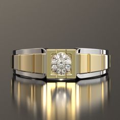 a gold and silver ring with a diamond in the center, on a reflective surface