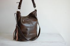 LEATHER TOTE Bag, Women's Handbag Leather Hobo Bag Large Tote Leather Handbag Large Cross Body Leather shoulder Bag Brown Leather Hobo Bag This Handbag is the perfect size to carry your daily essentials in style! It is made from high quality leather. This leather bag can be used as a tote and messenger bag. By using the adjustable leather strap you can convert it into a crossbody bag. This leather bag is a perfect everyday bag! There is a lot of space and you can put there everything in your eve Leather Travel Shoulder Bag With Tassels, Leather Satchel With Tassels For Travel, Leather Shoulder Bag With Tassels For Travel, Everyday Bucket Shoulder Bag With Tassels, Travel Shoulder Bag With Tassels, Rectangular Fringe Bucket Bag For Travel, Leather Hobo Bag With Tassels For Everyday, Everyday Leather Hobo Bag With Tassels, Leather Rectangular Bag With Tassels