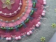 an art work made out of felt and beads