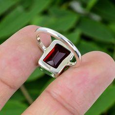 Natural Garnet Ring, Handmade Silver Ring, 925 Sterling Silver Ring, Designer Rectangle Garnet Ring, Anniversary Ring, January Birthstone A B O U T ∙ I T E M * Material:- 925 Sterling Silver * Ring Sizes:- All Size Available * Purity Metal:- 925 * Gemstone:- Garnet * Stone Shape:- Cushion * Stone Size:- 8*10 B E N E F I T S * Its energy is believed to ground and stabilize the wearer, enabling them to make rational decisions and stay focused. The stone is also considered beneficial for boosting intuition and fostering spiritual growth. Additionally, Black Onyx is thought to enhance communication by promoting clarity and self-expression. N O T E * We Use Good Quality Gemstone or 925 Solid Silver For Ring You Can Select Any Ring Size You Want From Drop Down Menu. Photos is Copyright All Right Rectangular Promise Ring Stamped 925, Rectangular Ruby Ring For Anniversary, Rectangular Ruby Ring With Polished Finish As Gift, Elegant Garnet Rings In Rectangular Shape, Rectangular Sterling Silver Crystal Ring As Gift, Rectangular Ruby Ring In Sterling Silver, Square Sterling Silver Gemstone Rings, Sterling Silver Square Gemstone Ring, Rectangular Garnet Rings In Red