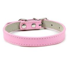 a pink leather dog collar with silver hardware