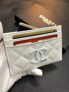 Indulge in timeless elegance with the Luxury Chanel Classic Wallet Card Holder. Merging iconic design with unparalleled craftsmanship, this exquisite accessory embodies the essence of sophistication. Crafted from the finest quality materials, each detail of this card holder reflects Chanel's legacy of luxury. The classic quilted pattern, synonymous with Chanel's signature style, adorns the exterior, lending an air of refinement to every touch. Compact yet functional, this wallet card holder seam Bags Classy, Chanel Iphone Case, Signature Quilts, Pocket Books, Branded Wallets, Spa Design, Favorite Handbags, Quilted Pattern, Luxury Wallet