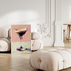 a painting sitting on top of a hard wood floor next to a footstool