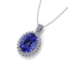 From concept to creation, this Tanzanite Lady Di Necklace was crafted by the master jewelry artisans at Jewelry Designs. Luxury Tanzanite Gemstones In Halo Setting, Luxury Purple Tanzanite Necklace, Exquisite Luxury Tanzanite Jewelry, Luxury Tanzanite Necklace For Women, Luxury Tanzanite Oval Pendant Necklace, Luxury White Gold Tanzanite Jewelry, Brilliant Cut Tanzanite Gemstones For Gift, Brilliant Cut Tanzanite Gemstones As Gift, Luxury Tanzanite Necklace With Brilliant Cut