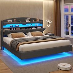 a bed with blue lights on the headboard and foot board is in a bedroom