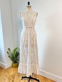 insanely beautiful antique Edwardian geometric heart shaped embroidered & eyelet lace dress. This dress has a stunning floral embroidered and eyelet skirt with high quality cotto. Hook & eye closure are present at the back middle & the top closure has been fixed since photographed!  In excellent vintage condition some very minor discolorations at hem of skirt, but in really good condition considering its age  B: 36" W: 28" L: 58 Bohemian Lace Dress With Broderie Anglaise, Sleeveless Lace Dress With Scalloped Lace For Daywear, Sleeveless Scalloped Lace Dress For Daywear, Fitted Feminine Lace Dress With Broderie Anglaise, Lace Dress With Broderie Anglaise For Garden Party, Fitted Cotton Lace Dress With Broderie Anglaise, Fitted Cotton Lace Broderie Anglaise Dress, Elegant Broderie Anglaise Cotton Lace Dress, Fitted Bohemian Lace Dress With Scalloped Lace