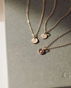 The no-stress way to dress your entire bridal party—curated by us, discounted for you! This bridesmaid jewelry set includes your choice of up to seven Personalized Yue Necklaces crafted in one chosen metal, each with their own initial. These are pieces they’ll love on your wedding day and wear all the days after—meaningful gifts and timeless looks all in one. Each necklace arrives packaged separately in our sleek new gift-ready boxes, with letterpress cards to fill out at home. To order, select Tarnish Resistant Wedding Jewelry Round Pendant, Tarnish Resistant Round Pendant Jewelry For Wedding, Tarnish Resistant Round Pendant For Wedding, Elegant Tiny Charm Necklaces In 14k Gold Filled, Tarnish Resistant Pendant Jewelry For Wedding, Sterling Silver Charm Necklaces For Weddings, Elegant Silver Gold Charm Necklaces, Sterling Silver Fine Jewelry Charm Necklaces For Wedding, Tarnish-resistant Pendant Jewelry For Weddings