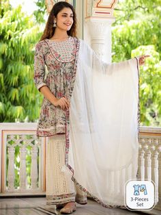 Floral Printed Pleated Thread Work Kurti & Sharara With Dupatta Product Details: Cream-coloured, white & grey printed kurti with sharara with dupatta Kurta design: Floral printed Anarkali shape Pleated style Round neck, three-quarter regular sleeves Thread work detail Above knee length with flared hem Pure cotton machine weave fabric Sharara design: Embroidered sharara Partially elasticated waistband Slip-on closure Size & Fit Dupatta length: 2.25mtr & Dupatta width: 1mtr he model (height 5'8) i White Mulmul Palazzo Set For Designer Wear, Off White Sharara For Festivals With Straight Kurta, Off White Sharara With Straight Kurta For Festivals, White Sharara With Cutdana For Diwali, Off White Straight Kurta Sharara For Festivals, Designer White Salwar Kameez With Printed Motifs, White Mulmul Sharara With Printed Motifs, Traditional Off-white Anarkali Set With Printed Motifs, Off White Cotton Anarkali Set With Sheer Dupatta