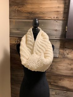 Looking for a fabulous winter look?  Then you have found it here with this scarf.  This cream coloured infinity scarf is soft, warm and stylish.  It will keep away the chill.  Made with a soft cream blended yarn(20% wool), it is machine washable.  Lay flat to dry. Winter Knitted Infinity Scarf For Cold Weather, Knit Infinity Scarf One Size, Winter Acrylic Infinity Scarf, Hand Knitted Acrylic Yarn Infinity Scarf For Winter, Hand Knitted Acrylic Infinity Scarf For Winter, Knitted One Size Infinity Scarf, Winter Hand Knitted Acrylic Infinity Scarf, One Size Knitted Infinity Scarf, Cozy Hand Knitted Infinity Scarf For Winter