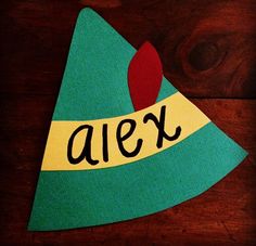 a paper hat with the word alex on it