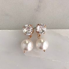 - Silver, gold or rose gold- Choose your own Swarovski pearl color- 1" length- .3" width- Pearl measures 10mm- Comes in signature gift box- Easy returnsThe perfect timeless pearl drop earring for the bride or bridesmaids.Shop the whole collection:https://www.etsy.com/shop/TigerlillyCouture>> Join our mailing list < Rose Gold Earrings With Pearl Charm For Anniversary, Rose Gold Pearl Charm Earrings For Anniversary, Rose Gold Dangle Pearl Earrings For Party, Rose Gold Dangle Pearl Party Earrings, Classic Rose Gold Pearl Earrings For Parties, Classic Rose Gold Pearl Drop Earrings, Delicate Hypoallergenic Rose Gold Pearl Earrings, Anniversary Rose Gold Pearl Earrings, Rose Gold Pearl Earrings For Party