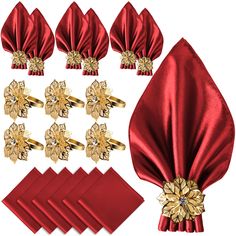 a set of red napkins with gold flowers on them and matching napkin clips,