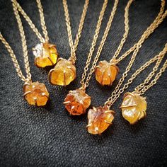 Golden raw natural citrine is set in a handcrafted prong in your choice of 14k gold filled or 925 sterling silver. Suspends from a delicate yet strong 1.1mm sparkling cable chain. ~Natural stones vary in size in color. Stones are approximately 12mm. ~Wrapped in black gift box ~Handmade in Tennessee Minimalist Amber Birthstone Jewelry, 14k Gold Amber Necklace For Gift, Handmade 14k Gold Yellow Jewelry, Citrine Necklace For Gift In Fine Jewelry Style, Unique Citrine Birthstone Jewelry, Handmade 14k Gold Amber Jewelry, Unique Citrine Gemstone Jewelry, Gold Crystal Necklaces With Natural Stones In Sterling Silver, Minimalist Citrine Jewelry As Gift