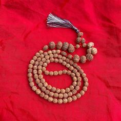 "Dimension:- Weight         : 43 Grams  Length          : 20.5\" Inches  Bead Size     : 7-20 MM (Small to big) No. of Beads : 107 Beads Shape            : Oval & Round Faces             : 1-14 Face, Ganesh, Gauri Shankar  Color              : Brown  Uses               : Meditation, Prayer  Certified by  : Rudraksha & Gems Testing Lab This is a divine Rudraksha Siddha Mala. Lab Certified 107 bead Rudraksha Siddha Mala Consist of 1 to 14 Mukhi, Gaurishankar, Ganesha Beads Rudraksha Mala.  Other items from our shop you may like it:- https://naturalcrystalshub.etsy.com/listing/1071204570 https://naturalcrystalshub.etsy.com/listing/1085151419 PACKAGING DETAILS:- We Wrap the product with multiple layers of bubble wrap and secure it with tape. We place the wrapped product in a suitable wooden or Festive Multicolor Spiritual Temple Necklace, Handmade Spiritual Mala For Puja, Handmade Temple Jewelry Beads For Rituals, Spiritual Round Beads Mala For Puja, Spiritual Mala With Round Beads For Puja, Spiritual Mala For Puja With Round Beads, Hand-strung Spiritual Mala For Puja, 8mm Beaded Mala For Festivals And Gifts, Spiritual Necklaces For Navratri