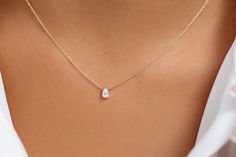 "Pear Shaped Diamond Necklace/ 14K Gold Pear Shape Diamond Choker Necklace/ Pear Shape Diamond Necklace / Black Friday Item Details * Made to Order. * Gold Kt: 14K (Please message me if you want 18K) * Custom Gold Color: Rose Gold, Yellow Gold, White Gold * Pear Shape Diamond: 1 pc 5.5 x 3.5MM * Total Number of Stones: 1 * Total CTW: 0.23 Ctw * Diamond Color-Clarity: G Color Si Clarity * Setting Type: Prong * Ready to Ship in 7-10 Business Days If you have any additional questions about this pro Dainty Pear-shaped White Gold Necklace, Timeless Pear-shaped Anniversary Necklace, Elegant Drop Shape Birthstone Necklace, Elegant Drop Birthstone Necklaces, Elegant Drop Birthstone Necklace, Formal Drop Necklace With Birthstone, Elegant Birthstone Drop Necklace, Classic 14k Gold Pear-shaped Necklace, Pear-shaped Diamond Birthstone Necklace