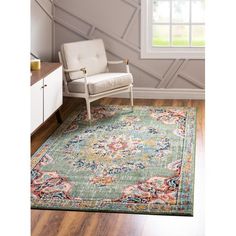 an area rug with a chair and window in the background