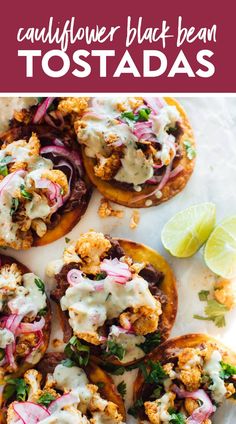 an overhead shot of cauliflower black bean tostadas with lime wedges