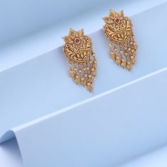 Description Inspired by the shimmering Indian gold jewelry. This Collection is designed to highlight fine Indian craftsmanship. It is crafted in gold-plated 925 silver with intricate textures and tones. Modern designs adorn you with timeless floral patterns. This jewelry is perfect for wedding and festival events. Created by Paksha design experts, the Swara Floral Frill Drop Earrings feature beautiful chains, coming together in a joyful dance. The stud is designed with timeless florals to add th Temple Style 22k Gold Bridal Drop Earrings, Temple Jewelry Style Bridal Drop Earrings In 22k Gold, Temple Jewelry Bridal Drop Earrings In 22k Gold, Yellow Gold Earrings For Wedding And Diwali, 22k Gold Bridal Earrings For Anniversary And Festivals, 22k Gold Bridal Earrings For Festivals And Anniversaries, 22k Gold Temple Bridal Earrings For Celebration, 22k Gold Temple Jewelry Bridal Earrings For Celebration, Festive 22k Yellow Gold Bridal Earrings