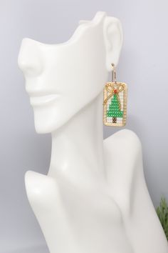 Introducing our fabulous and festive Christmas Tree Earrings. Hand beaded using premium seed beads and golden brass accents, these playful and gorgeous earrings add an extra touch of charm to your holiday ensemble. The perfect gift option, these eye-catching earrings make for an ideal stocking stuffer or a thoughtful present for a loved one. With these festive holiday earrings, you're sure to make a statement and spread joy wherever you go! Choice of with bow or without ✔️1 5/8 inches long & 5/8 Holiday Jewelry Gift With Colorful Beads, Holiday Gift Jewelry With Colorful Beads, Colorful Beaded Jewelry For Holiday Gifts, Christmas Gift Beaded Drop Earrings, Holiday Handmade Beaded Earrings Gift, Handmade Beaded Earrings For Holiday Gifts, Gold Beaded Dangle Earrings For Gifts, Christmas Beaded Earrings As Gift, Christmas Gift Beaded Earrings