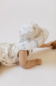 Keep your little sailor shaded with this adorable bucket hat featuring a broad brim, an adjustable strap and a fun print packed with friendly sea creatures. 100% organic cotton Machine wash, tumble dry Imported Backyard Picnic, Life Aquatic, Toddler Hat, Organic Baby Clothes, Cotton Romper, Organic Cotton Baby, Spring Baby, Cute Rompers, One Piece Outfit