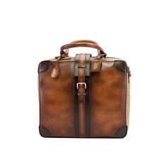 Ideal for the business traveler, the Travel Tote with the classic name tag and leather handles gives you that timeless briefcase style, measuring 14.2 x 16.5 x 6.3 inches / 36 x 42 x 16 cm. It has a main zip closure with a locking buckle strap to secure it. Designed to be functional and minimalist, it features an internal zipped pocket and a full lined interior. The removable shoulder strap makes it perfect for hands-free travel. THE DETAILS: *Burnished Materials: tweed sartorial + cognac painte Boots Store, Mens Travel, Brown Tweed, Leather Artisan, Travel Tote Bag, Tote Bag Leather, Travel Tote, Leather Travel, Leather Handles