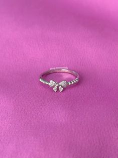 A stunning ring featuring a ribbon bow tie with sparkly cubic zirconia stones. - Water resistant - 925 sterling silver - Will not rust or tarnish - Select desired size at checkout Bow Tie Ring, Cute Promise Rings, Ribbon Bow Tie, Tie Ring, Present Birthday, Silver Ribbon, Bow Ring, Jewelry Accessories Ideas, Dope Jewelry