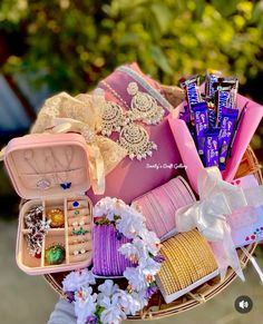 a basket filled with lots of different types of jewelry