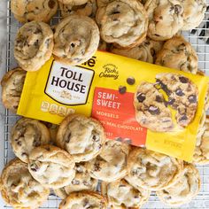 chocolate chip cookies and toll house cookie bars on a cooling rack with one bag of toll house